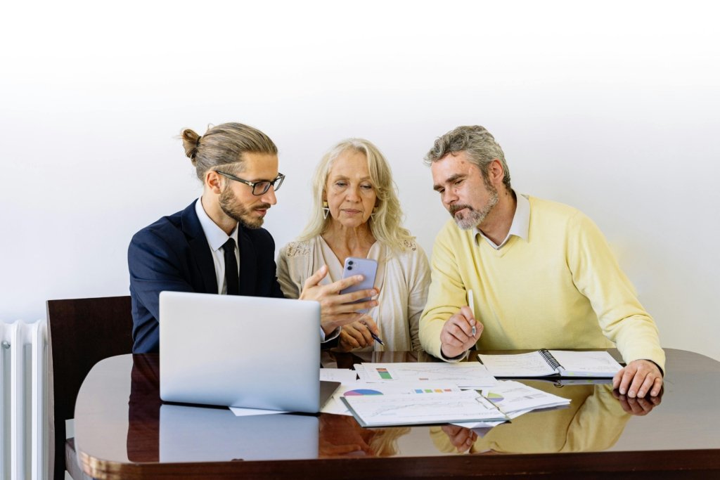 People sitting down in front of documents