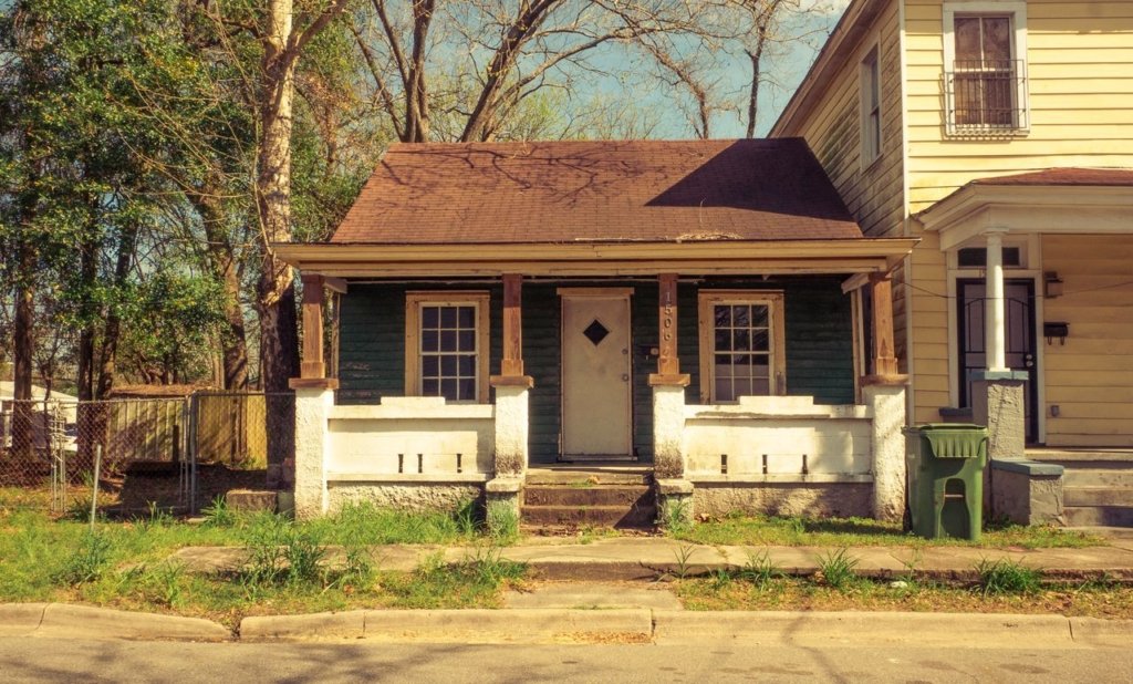 front view of a single-story house with garden landscaping