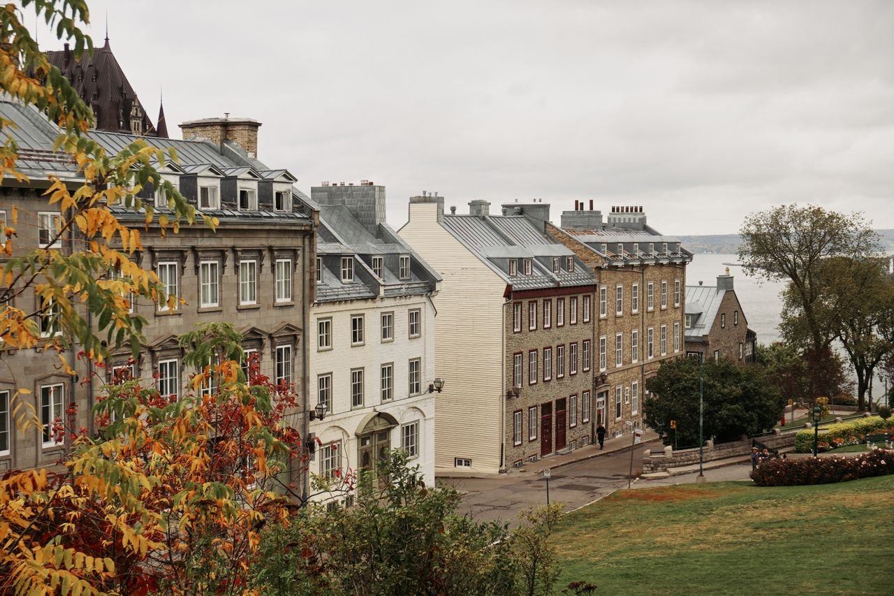 a view of historic buildings in Old Quebec City during fall